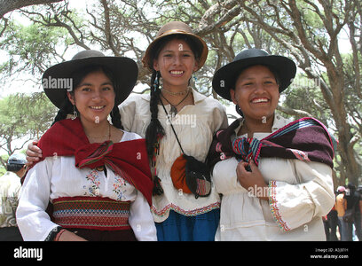 three-young-bolivian-women-in-hats-with-traditional-cloths-in-tiataco-A5J81H.jpg